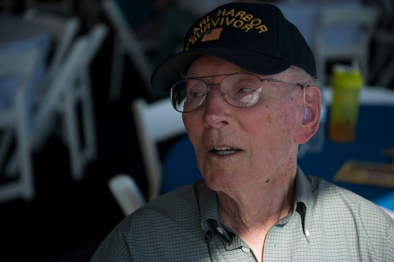 Lenoard Nielson, sits and watches the Aviation Nation air show held at Nellis Air Force Base, Nev., Nov. 12. Nielson is one of the few Pearl Harbor suvivors still around in Nevada. During Pearl Harbor he was aboard the USS Solace and helped assist those who were injured. (U.S. Air Force photo by Senior Airman Rachel Loftis/released)