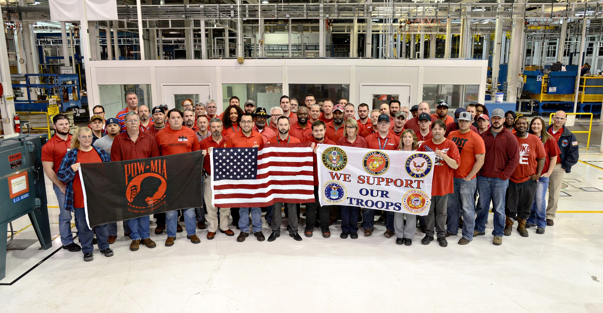 In honor of Veterans Day and to support all deployed troops, members of the F119 Heavy Maintenance Center participated in R.E.D. (Remember Everyone Deployed) Shirt Friday Nov. 10. The F-22 Raptor engine shop is comprised of members from the 76th Propulsion Maintenance Group and Pratt and Whitney, the first partnership between the Oklahoma City Air Logistics Complex and a civilian company. (Air Force photo by Kelly White)