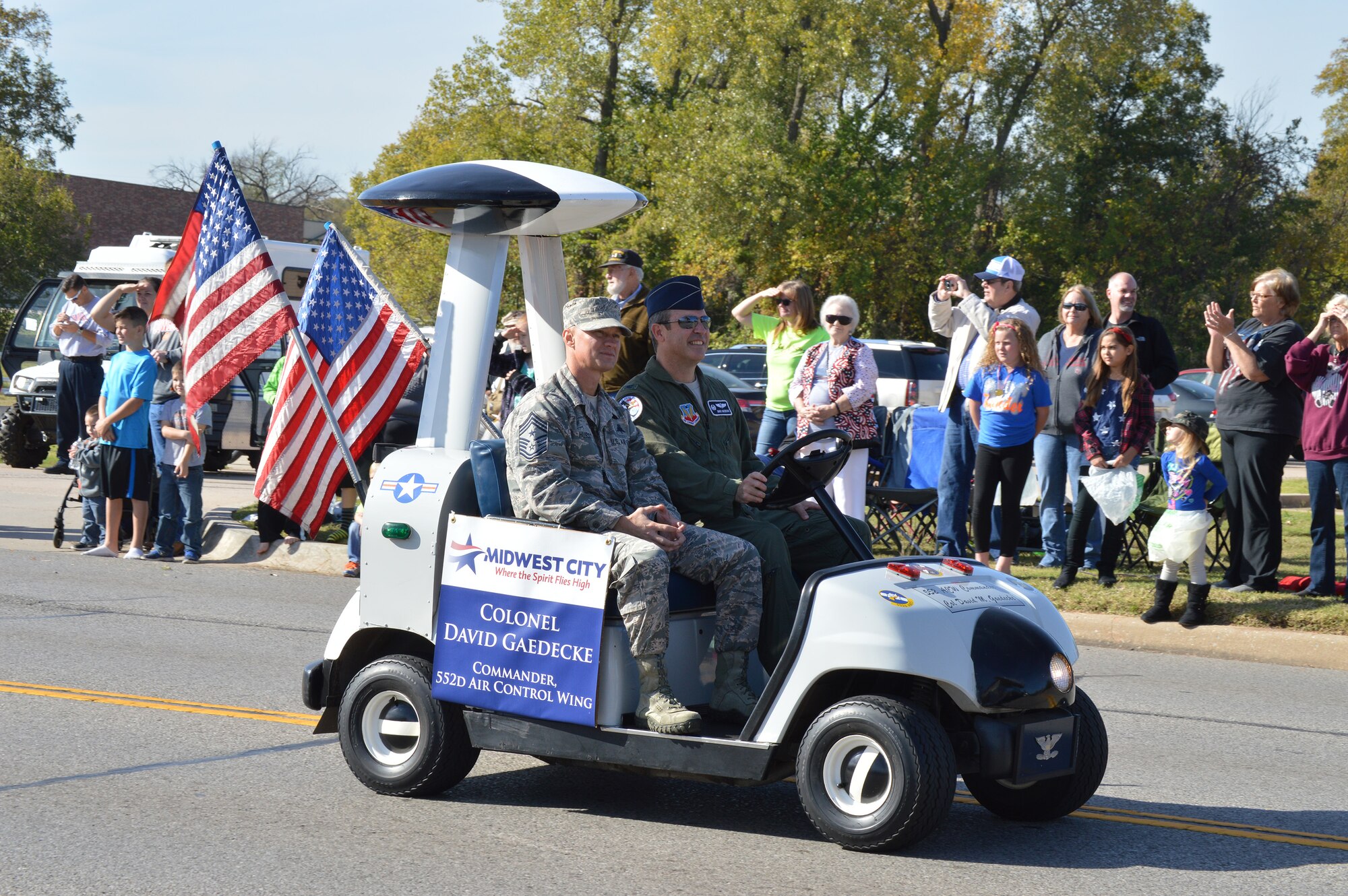 Col. David Gaedecke, 552nd Air Control Wing commander, right, and 552nd ACW Command Chief Master Sgt. Mark Hurst show off AWACS pride in the annual Midwest City event. (Air Force photo by April McDonald)