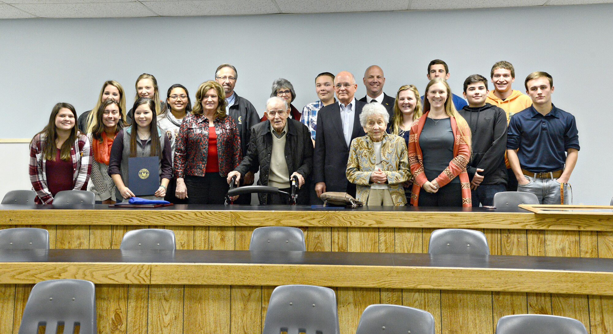 Family members of Maj. Gen. Clarence Tinker pose for a picture with members of the Pawhuska High School Student Council and Leadership class and school faculty Nov. 11. The students in the Leadership Class are renovating a lecture hall in their school and dedicating it in honor of General Tinker, who was a native of Pawhuska as well a member of the Osage Nation. (Air Force photo by Kelly White)