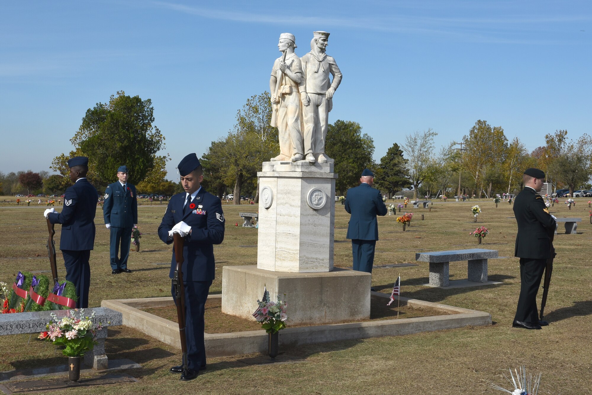 A combined Canadian/American Honor Guard is formed around a cenotaph at the Arlington Memory Gardens Cemetery, in honor of Remembrance Day Nov. 11. (Air Force photo by Ron Mullan)