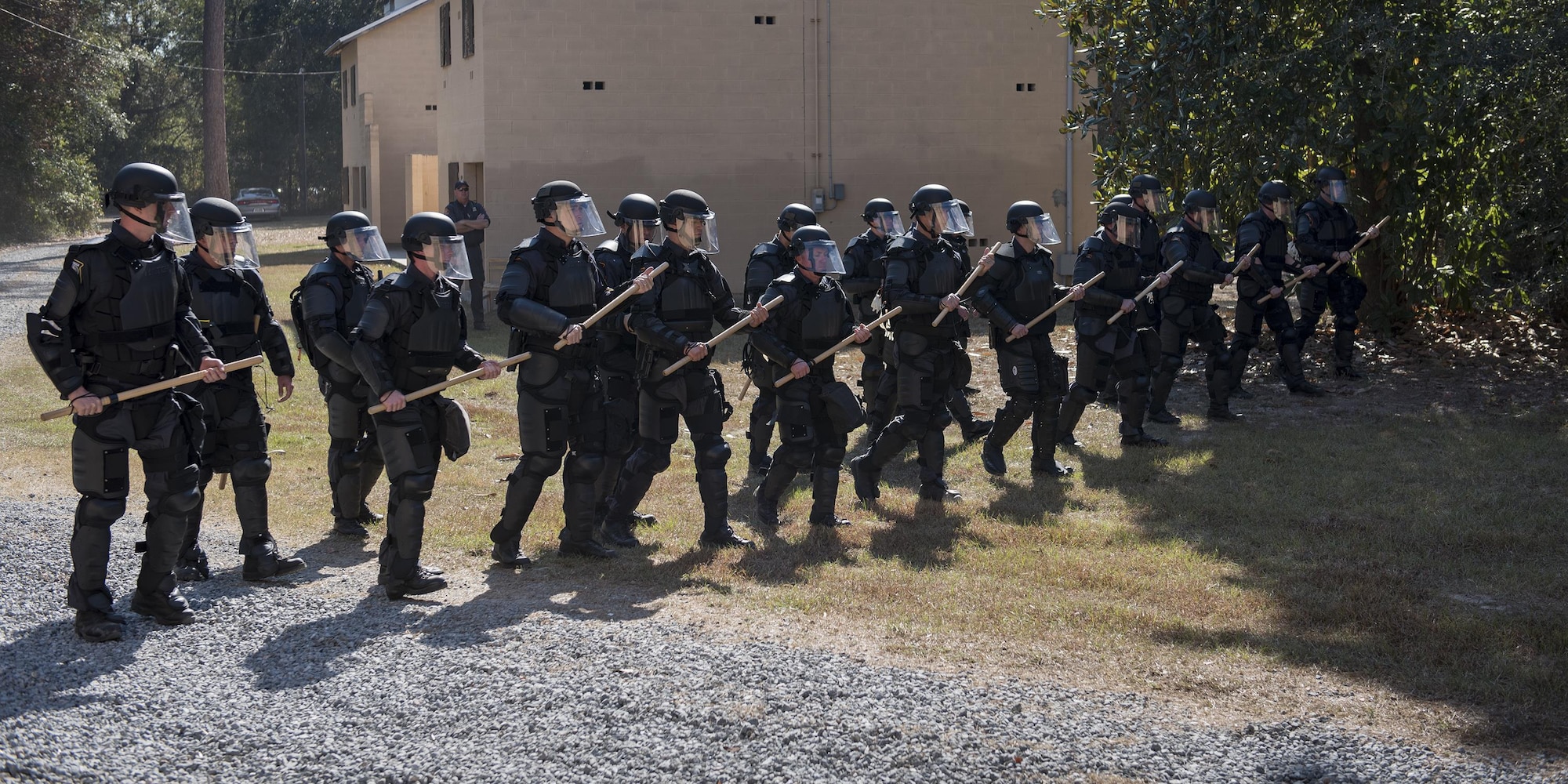 Georgia State Patrol’s Mobile Field Force create a wall of police officers as they march forward, Nov. 16, 2016, at Moody Air Force Base, Ga. The GSP conducts semiannual riot control training to ensure readiness if a situation arises. (U.S. Air Force photo by Airman 1st Class Daniel Snider)
