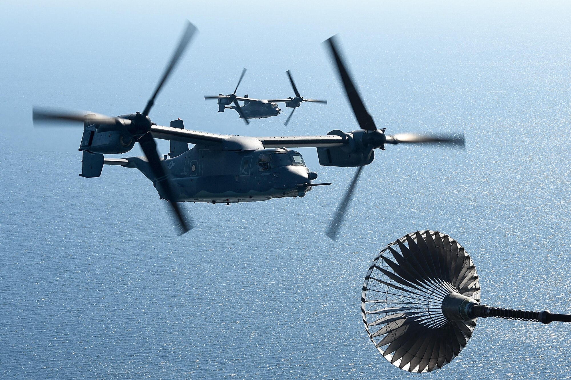 Two CV-22 Osprey tiltrotor aircraft assigned to the 8th Special Operations Squadron make their approach for a tiltrotor air-to-air refueling with an MC-130H Combat Talon II assigned the 15th SOS over the Gulf of Mexico, Nov. 17, 2016. Secretary of Defense Ash Carter visited with Air Force Special Operations Command Air Commandos, participated in a Joint Assault Force with Special Tactics teams and flew on a CV-22 during his visit to Hurlburt Field, Fla. (U.S. Air Force photo by Senior Airman Jeff Parkinson)