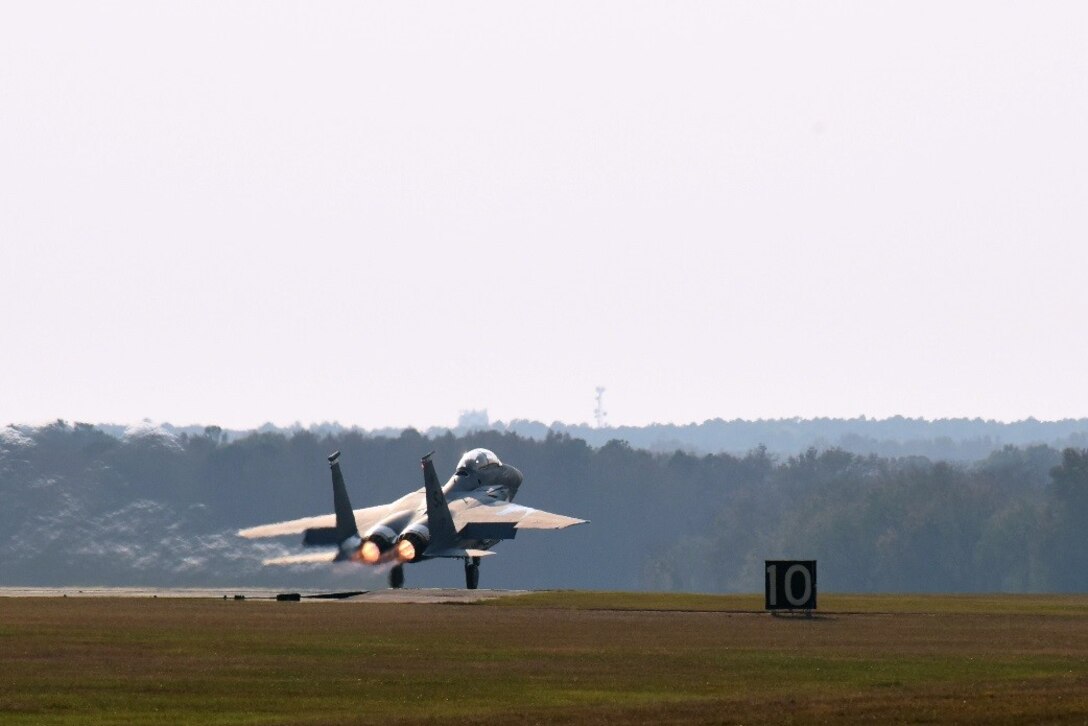 Maj. Adam Mattheis, 335th Fighter Squadron F-15E Strike Eagle pilot, takes off during a familiarization flight with Gen. Petr Pavel, NATO military committee chairman, Nov. 15, 2016, at Seymour Johnson Air Force Base, North Carolina. During the flight, Pavel experienced different aircraft handling maneuvers, and saw the Air Force Dare Bomb Range, which is primarily used for training, and is an electronic combat, day-night, and air-to-ground training site critical to Seymour Johnson AFB and Army and Navy special operations teams. (U.S. Air Force photo by Airman Miranda A. Loera)
