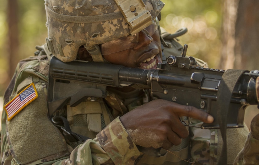 Pvt. Rolando Swaby, an Army Reserve Soldier in basic combat training with Company A, 1st Battalion, 61st Infantry Regiment at Fort Jackson, S.C., takes aim at his target at the hand grenade assault course, Oct. 19. (U.S. Army Reserve photo by Sgt. Stephanie Hargett/ released)