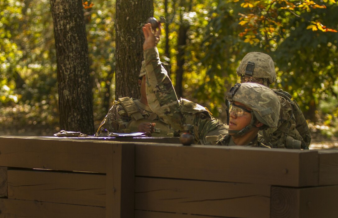 Pvt. Diego Garcia, an Army Reserve Soldier in basic combat training with Company A, 1st Battalion, 61st Infantry Regiment at Fort Jackson, S.C., tosses a hand grenade into the air at the hand grenade assault course, Oct. 19. (U.S. Army Reserve photo by Sgt. Stephanie Hargett/ released)