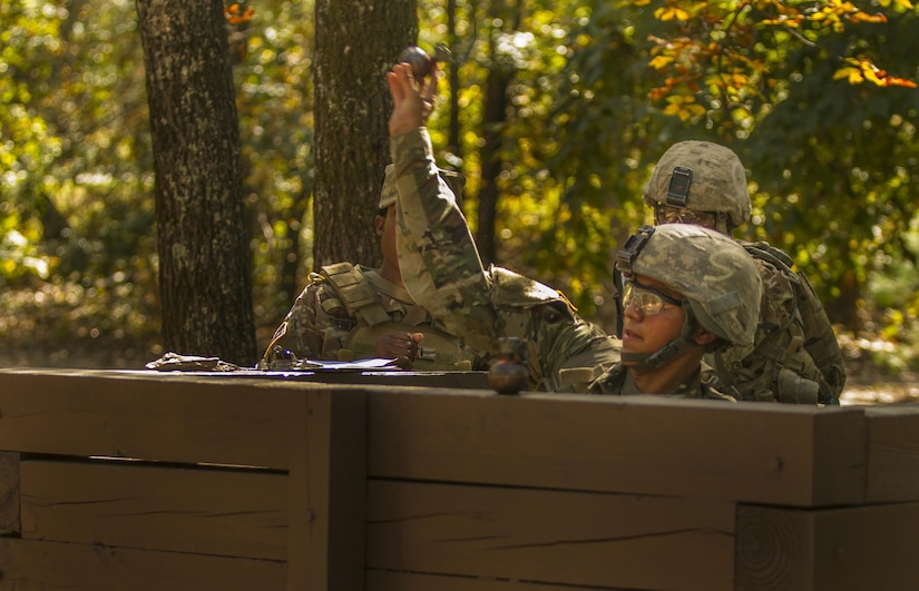 Pvt. Diego Garcia, an Army Reserve Soldier in basic combat training with Company A, 1st Battalion, 61st Infantry Regiment at Fort Jackson, S.C., tosses a hand grenade into the air at the hand grenade assault course, Oct. 19. (U.S. Army Reserve photo by Sgt. Stephanie Hargett/ released)