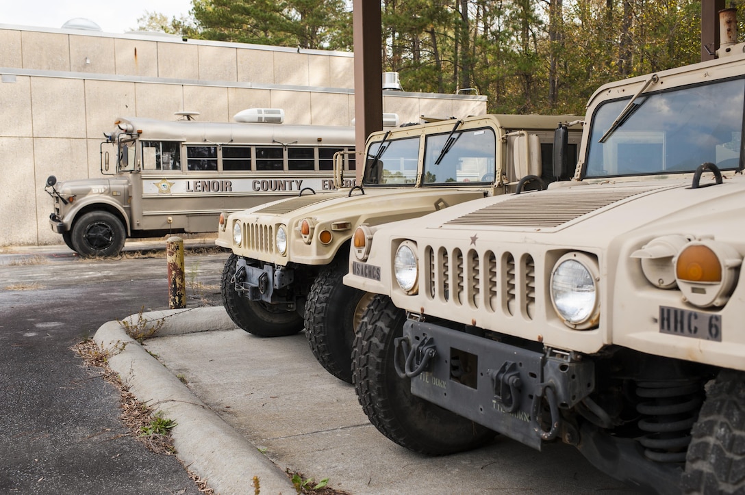 A mobile command post and Humvees belonging to the Lenoir County Sheriff’s office sit in the motor pool of a underutilized U.S. Army Reserve Center in Kinston, N.C., Nov. 2, 2016. After Hurricane Matthew flooded the courthouse basement in early October, the sheriff’s office reached out to the 81st Regional Support Command who owned the center at the Kinston airport. Through the National Defense Authorization Act of 2012, U.S. Army Reserve Defense Support of Civil Authorities and Stafford Act (Disaster and Emergency Act), the sheriff’s office was able to use the facility to continue to serve the citizens of Lenoir County.  (U.S. Army photo by Timothy L. Hale)(Released)