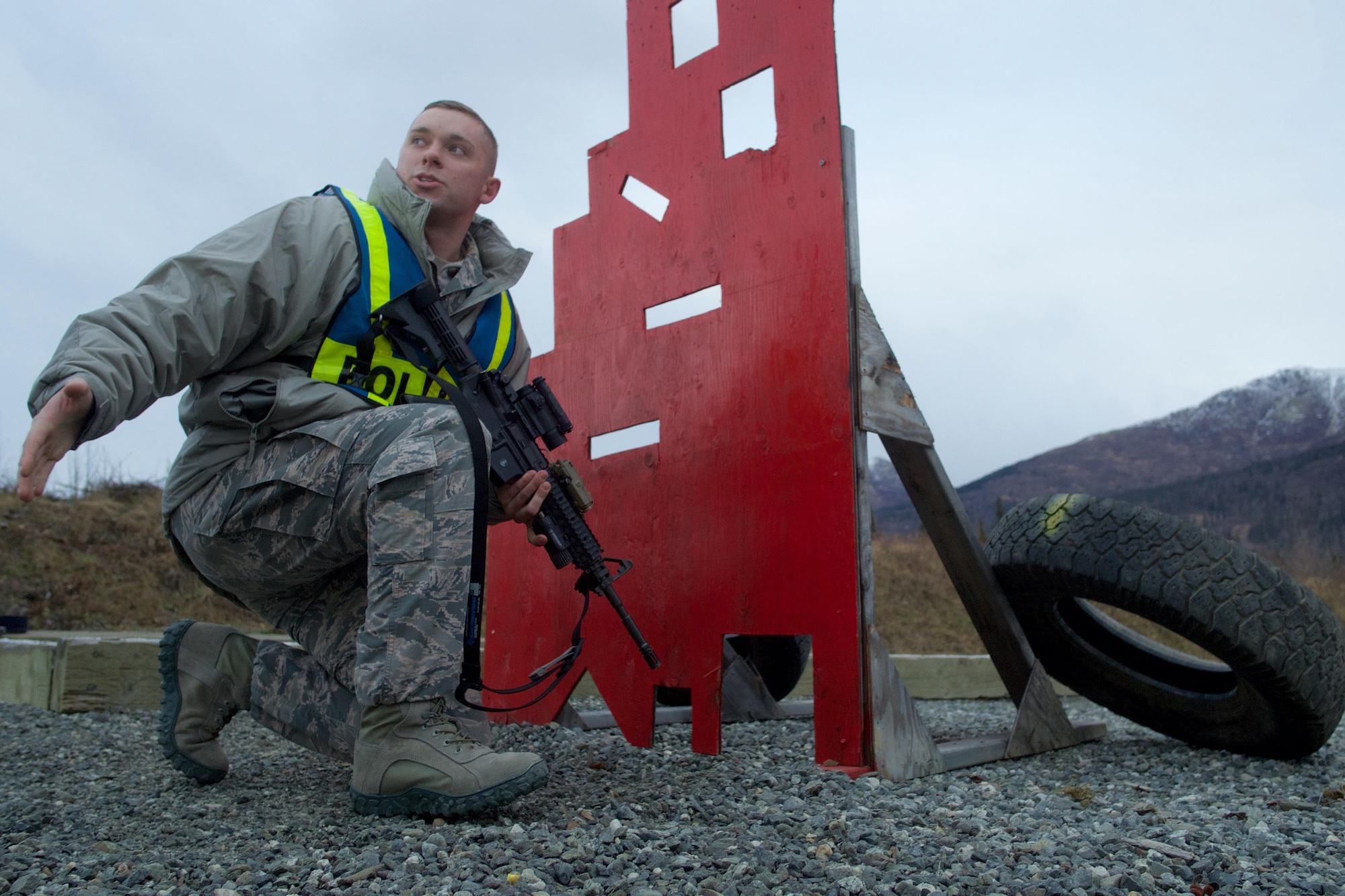 Air Force Staff Sgt. Richard Robbins, a native of Hattiesburg, Miss., and a member of 673d Security Forces Squadron, instructs Airmen on the proper techniques for engaging targets from behind a barricade, Nov. 9, 2016, at Joint Base Elmendorf-Richardson. Airmen have to maintain strict muzzle awareness during the training, ensuring they don’t shoot the barricade due to the difference between what is seen through the sight and what the barrel is actually pointing at.