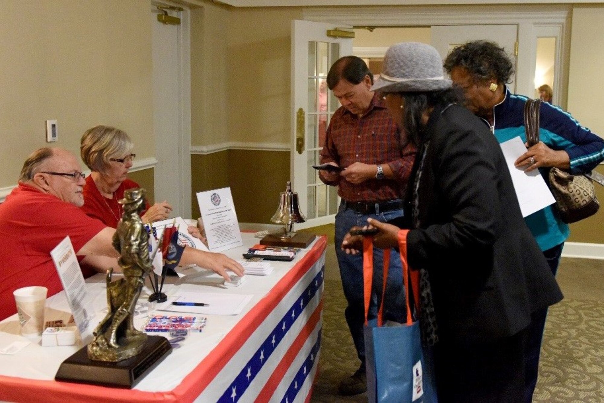 Retired service members visit various information booths during the second annual Retiree Appreciation Night event, Nov. 10, 2016, at Seymour Johnson Air Force Base, North Carolina.  The event was held in appreciation for retirees’ service to the country in conjunction with Veterans Day and to distribute information about base services available to them.  (U.S. Air Force photo by Airman Miranda A. Loera)