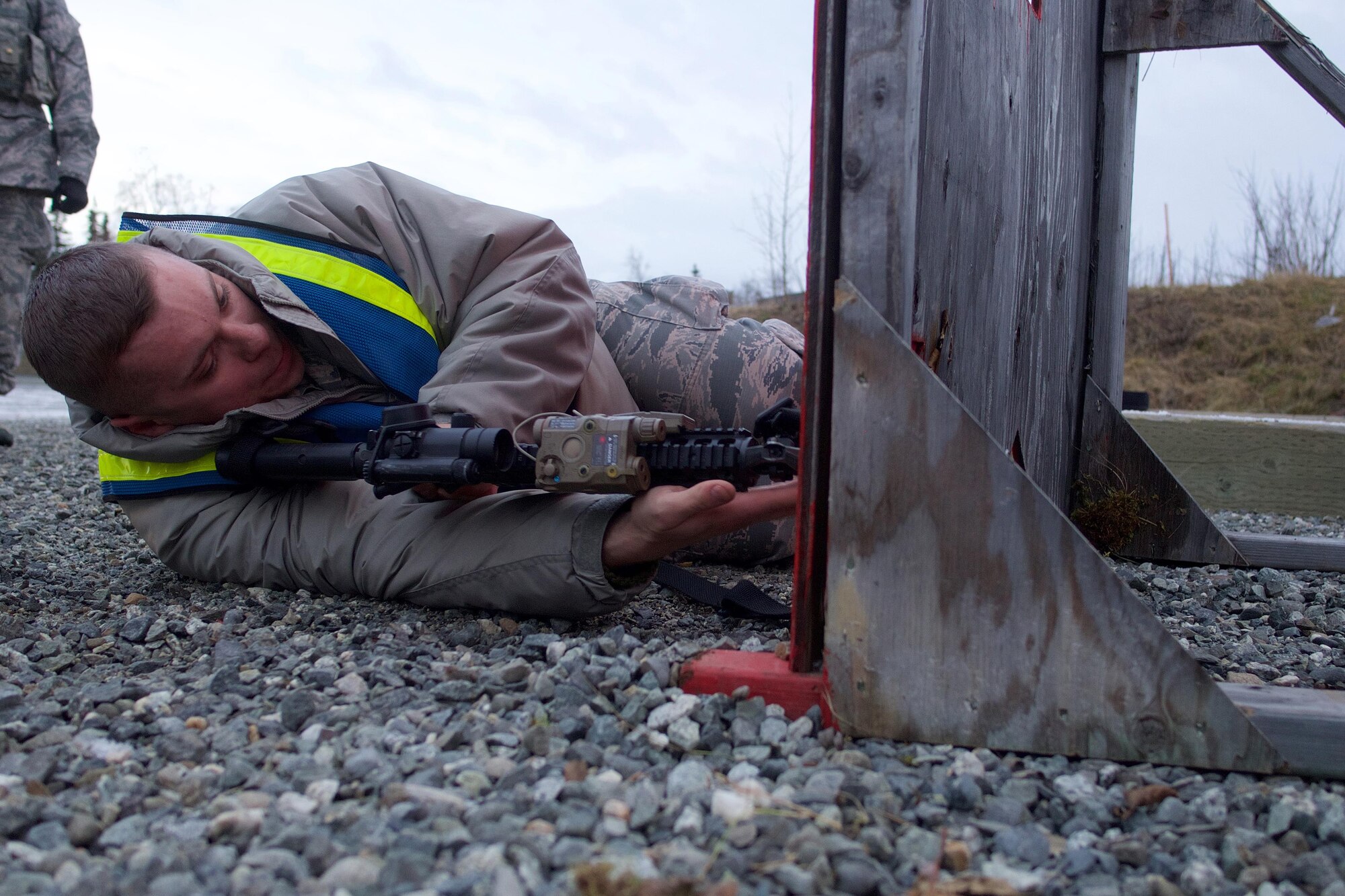 Air Force Staff Sgt. Richard Robbins, a native of Hattiesburg, Miss., and a member of 673d Security Forces Squadron, instructs Airmen on the proper techniques for engaging targets from behind a barricade, Nov. 9, 2016, at Joint Base Elmendorf-Richardson. Airmen have to maintain strict muzzle awareness during the training, ensuring not to shoot the barricade due to the difference between what is seen through the sight and what the barrel is actually pointing at. 