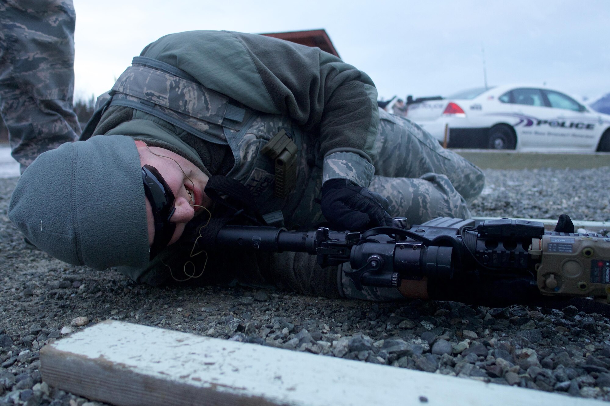 Senior Airman Ryan Treadwell, a native of Concord, Calif., and a member of 673d Security Forces Squadron, live-fire drills under a barricade Nov. 9, 2016, at Joint Base Elmendorf-Richardson. Airmen of 673d SFS went to JBER's Statler/Newton Small Arms Range for M4 Carbine Proficiency Firing training, which teaches them to maneuver behind cover while accurately engaging targets. 