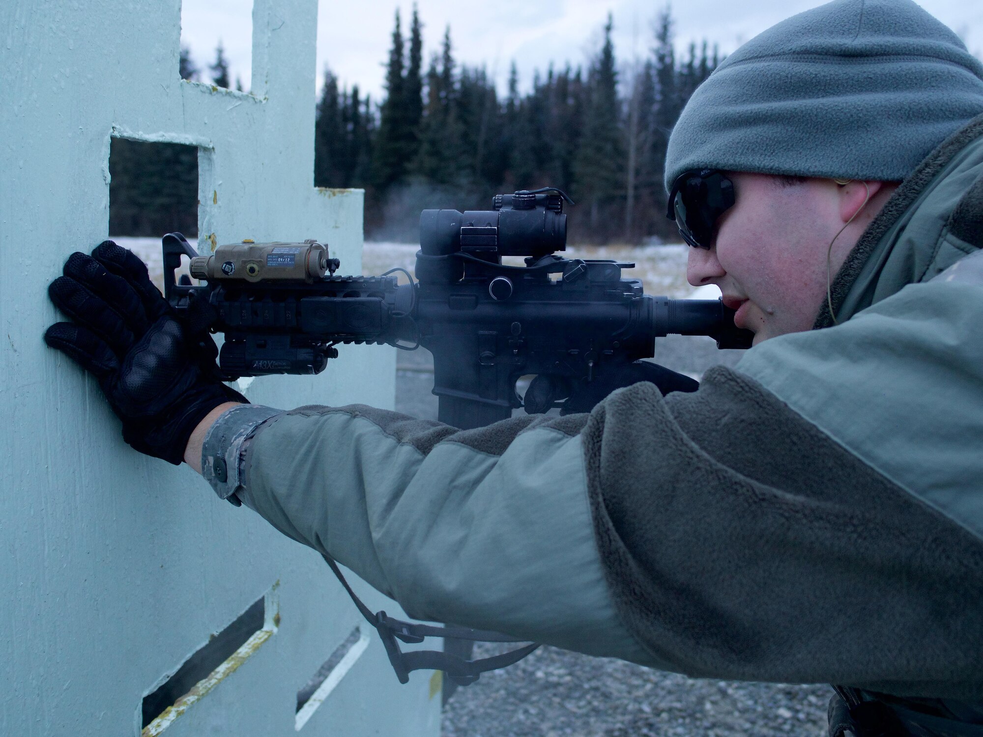 Senior Airman Ryan Treadwell, a native of Concord, Calif., and a member of 673d Security Forces Squadron, carries out live-fire drills behind a barricade Nov. 9, 2016, at Joint Base Elmendorf-Richardson. Airmen of 673d SFS went to JBER's Statler/Newton Small Arms Range for M4 Carbine Proficiency Firing training, which teaches them to maneuver behind cover while accurately engaging targets. 