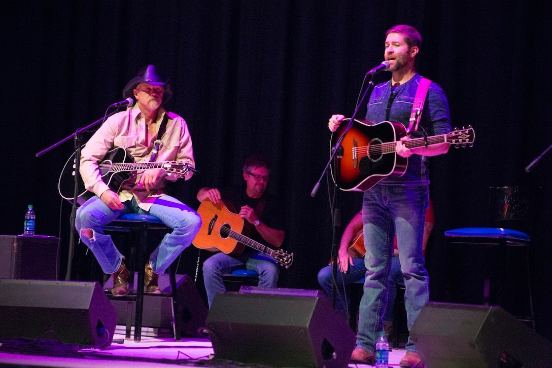 Trace Adkins ,left, and Josh Turner perform during the 8th annual Guitar Pull at Marine Corps Air Station Cherry Point, N.C. Nov. 16, 2016. More than 1,800 Marines, Sailors and members of the community came together to enjoy a free concert with musical artists like Jerrod Niemann, Josh Turner and more. The event brought forth an opportunity for service members and locals to interact with each other in a unique environment. Adkins and Turner are both country music singers performing in the Guitar Pull. (U.S. Marine Corps photo by Sgt. N.W. Huertas/ Released)