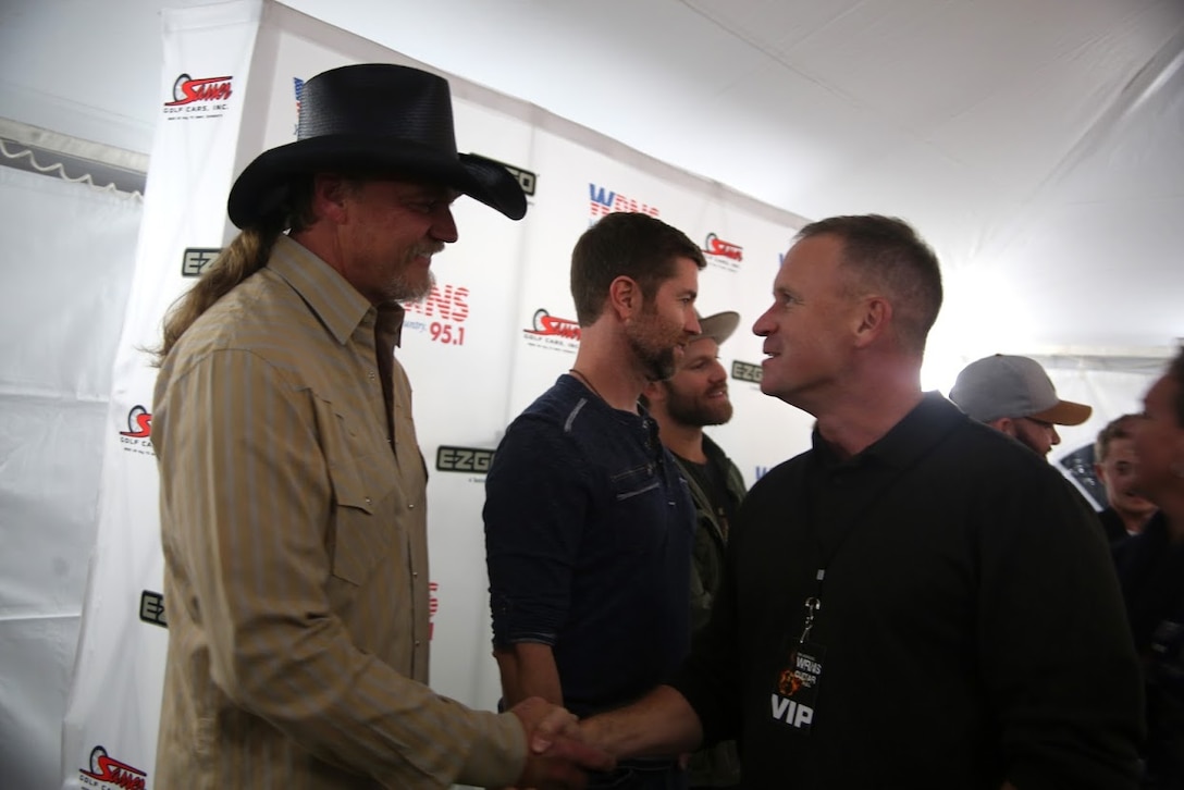 Trace Adkins, left, shakes the hand of Col. Todd Ferry during a meet and greet at the 8th annual Guitar Pull at Marine Corps Air Station Cherry Point, N.C. Nov. 16, 2016. More than 1,800 Marines, Sailors and members of the community came together to enjoy a free concert with musical artists like Trace Adkins, Jerrod Niemann, Josh Turner and more. The event brought forth an opportunity for service members and locals to interact with each other in a unique environment. Ferry is the commanding officer of MCAS Cherry Point. (U.S. Marine Corps photo by Sgt. N.W. Huertas/ Released)