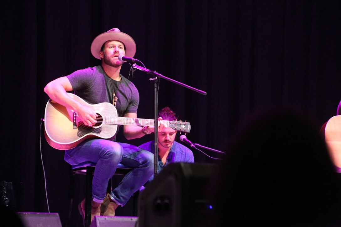 Drake White performs during the 8th annual Guitar Pull at Marine Corps Air Station Cherry Point, N.C. Nov. 16, 2016. More than 1,800 Marines, Sailors and members of the community came together to enjoy a free concert with musical artists like Trace Adkins, Jerrod Niemann, Josh Turner and more. The event brought forth an opportunity for service members and locals to interact with each other in a unique environment. White is a country music artist performing at the Guitar Pull. (U.S. Marine Corps photo by Sgt. N.W. Huertas/ Released)