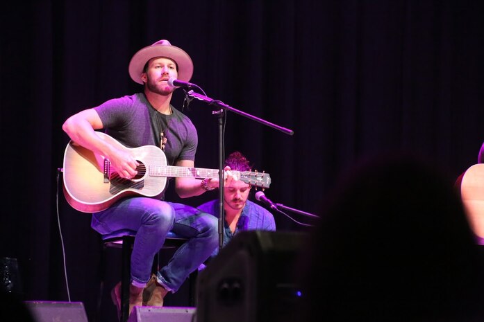 Drake White performs during the 8th annual Guitar Pull at Marine Corps Air Station Cherry Point, N.C. Nov. 16, 2016. More than 1,800 Marines, Sailors and members of the community came together to enjoy a free concert with musical artists like Trace Adkins, Jerrod Niemann, Josh Turner and more. The event brought forth an opportunity for service members and locals to interact with each other in a unique environment. White is a country music artist performing at the Guitar Pull. (U.S. Marine Corps photo by Sgt. N.W. Huertas/ Released)