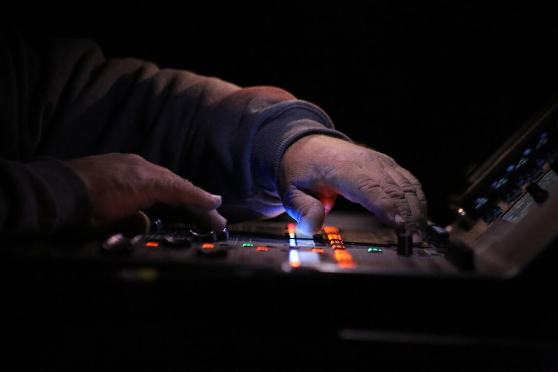A audio technician member of the stage crew adjusts sound levels during the 8th annual Guitar Pull at Marine Corps Air Station Cherry Point, N.C. Nov. 16, 2016. More than 1,800 Marines, Sailors and members of the community came together to enjoy a free concert with musical artists like Trace Adkins, Jerrod Niemann, Josh Turner and more. The event brought forth an opportunity for service members and locals to interact with each other in a unique environment. (U.S. Marine Corps photo by Sgt. N.W. Huertas/ Released)