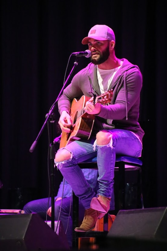 Dylan Scott performs during the 8th annual Guitar Pull at Marine Corps Air Station Cherry Point, N.C. Nov. 16, 2016. More than 1,800 Marines, Sailors and members of the community came together to enjoy a free concert with musical artists like Trace Adkins, Jerrod Niemann, Josh Turner and more. The event brought forth an opportunity for service members and locals to interact with each other in a unique environment. Scott is a country music singer performing at the event. (U.S. Marine Corps photo by Sgt. N.W. Huertas/ Released)