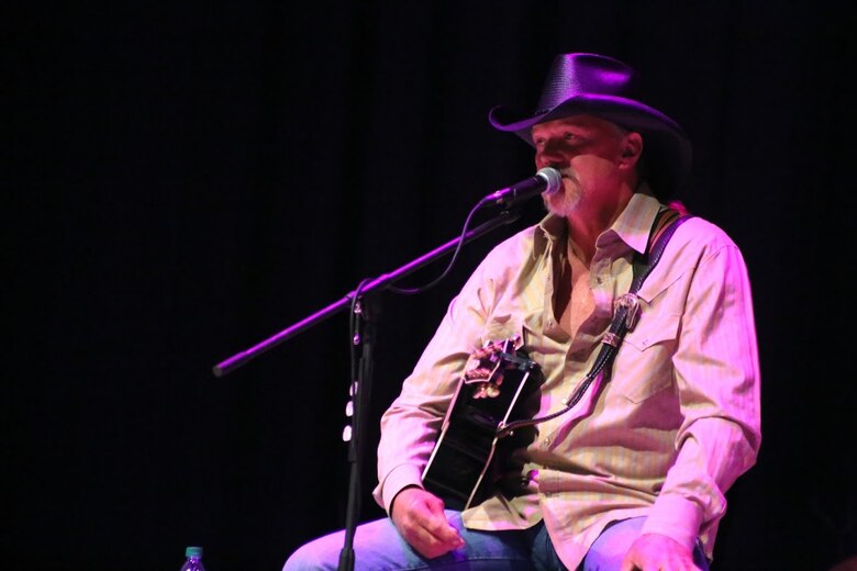 Trace Adkins addresses an audience during the 8th annual Guitar Pull at Marine Corps Air Station Cherry Point, N.C. Nov. 16, 2016. More than 1,800 Marines, Sailors and members of the community came together to enjoy a free concert with musical artists like Jerrod Niemann, Josh Turner and more. The event brought forth an opportunity for service members and locals to interact with each other in a unique environment. Adkins is a country music singer performing at the event. (U.S. Marine Corps photo by Sgt. N.W. Huertas/ Released)