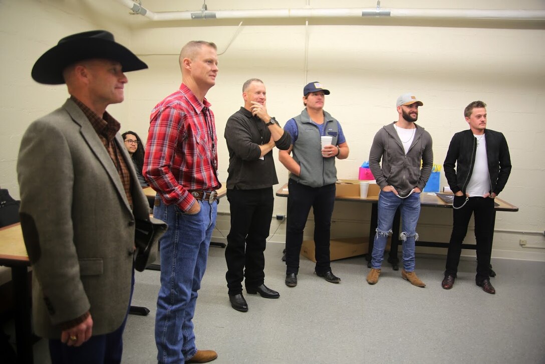 Officers and enlisted service members meet performing artists during the 8th annual Guitar Pull at Marine Corps Air Station Cherry Point, N.C. Nov. 16, 2016. More than 1,800 Marines, Sailors and members of the community came together to enjoy a free concert with musical artists like Trace Adkins, Jerrod Niemann, Josh Turner and more. The event brought forth an opportunity for service members and locals to interact with each other in a unique environment. (U.S. Marine Corps photo by Sgt. N.W. Huertas/ Released)