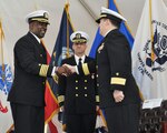 Capt. Godfrey Weekes, left, incoming commanding officer of the Naval Surface Warfare Center Dahlgren Division (NSWCDD), greets Rear Adm. Tom Druggan, right, commander of the Naval Surface Warfare Center (NSWC), and Capt. Brian Durant, center, outgoing commanding officer of NSWCDD, during a change of command ceremony Nov. 18 at Naval Support Facility (NSF) Dahlgren.