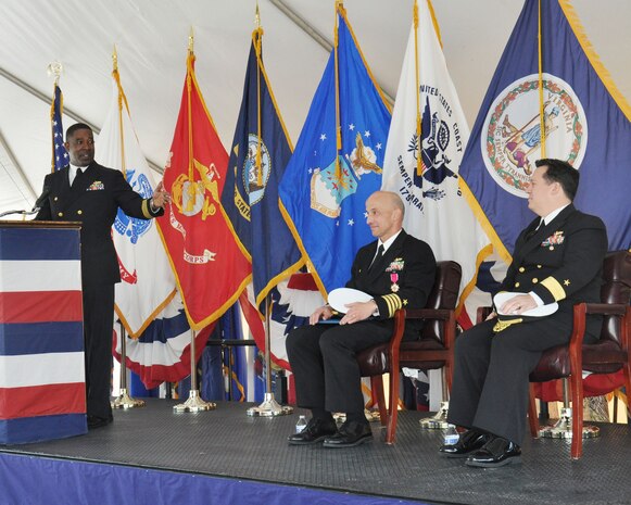 Capt. Godfrey Weekes, left, incoming commanding officer of the Naval Surface Warfare Center Dahlgren Division (NSWCDD), thanks Capt. Brian Durant, center, outgoing NSWCDD commanding officer, during a change of command ceremony Nov. 18 at Naval Support Facility (NSF) Dahlgren. Rear Adm. Tom Druggan, commander of the Naval Surface Warfare Center (NSWC), right, was the ceremony's guest speaker. 