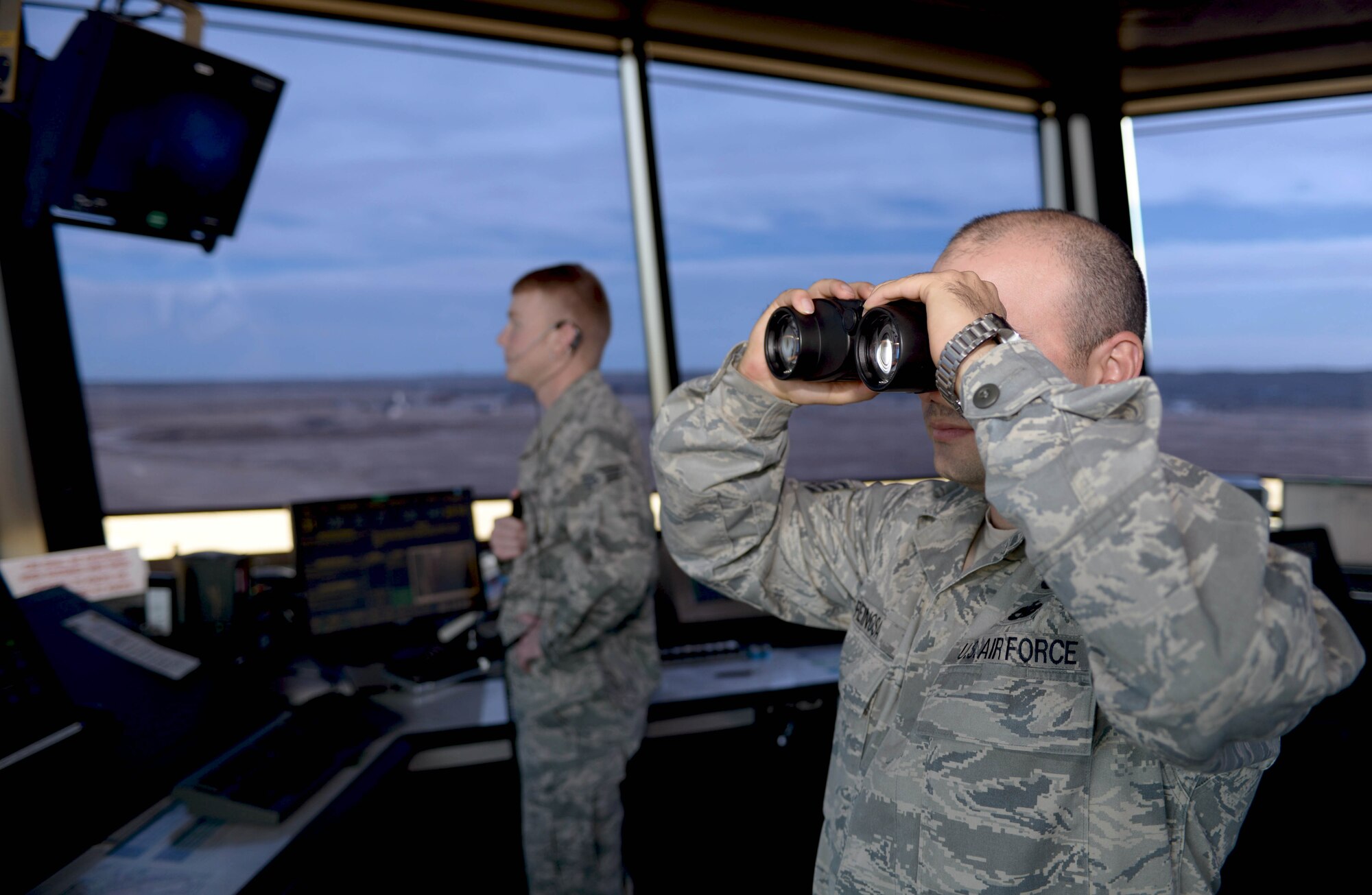 Staff Sgt. Yoendri Reinosa and Senior Airman Clinton Bruce, air traffic controllers assigned to the 28th Operations Support Squadron, watch as a B-1 bomber takes off at Ellsworth Air Force Base, S.D., Nov. 16, 2016. Basic duties of air traffic controllers include clearing aircraft, clearance deliveries and ensuring flight safety. (U.S. Air Force photo by Airman 1st Class Donald C. Knechtel)

