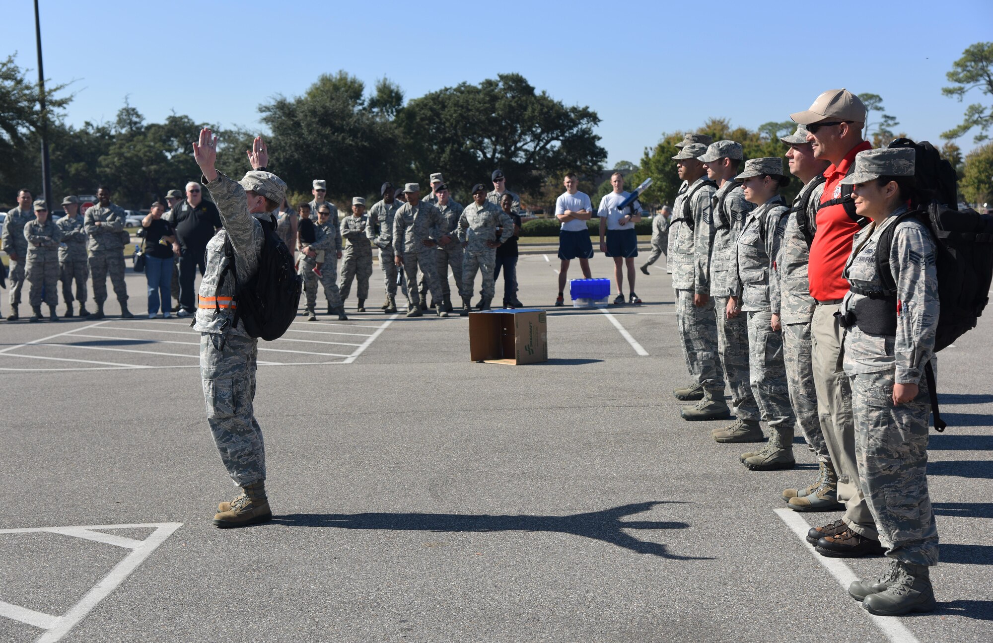 Capt. Rachel Reynolds, 336th Training Squadron director of operations, leads 81st Training Group members in a permanent party drill exhibition during Dragon Fest Nov. 17, 2016, on Keesler Air Force Base, Miss. Dragon Fest was the final event held for Dragon Week, which focused on resiliency and teambuilding initiatives across the base. (U.S. Air Force photo by Kemberly Groue)