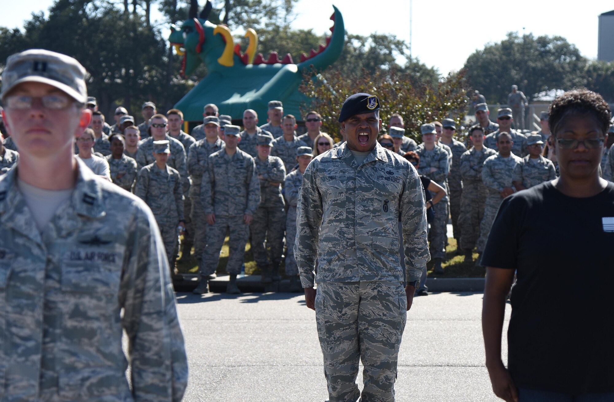 Staff Sgt. Courtney Hill, 81st Security Forces Squadron pass and ID NCO in charge, yells drill commands during a “Knock Out” drill competition at Dragon Fest Nov. 17, 2016, on Keesler Air Force Base, Miss. Dragon Fest was the final event held for Dragon Week, which focused on resiliency and teambuilding initiatives across the base. (U.S. Air Force photo by Kemberly Groue)