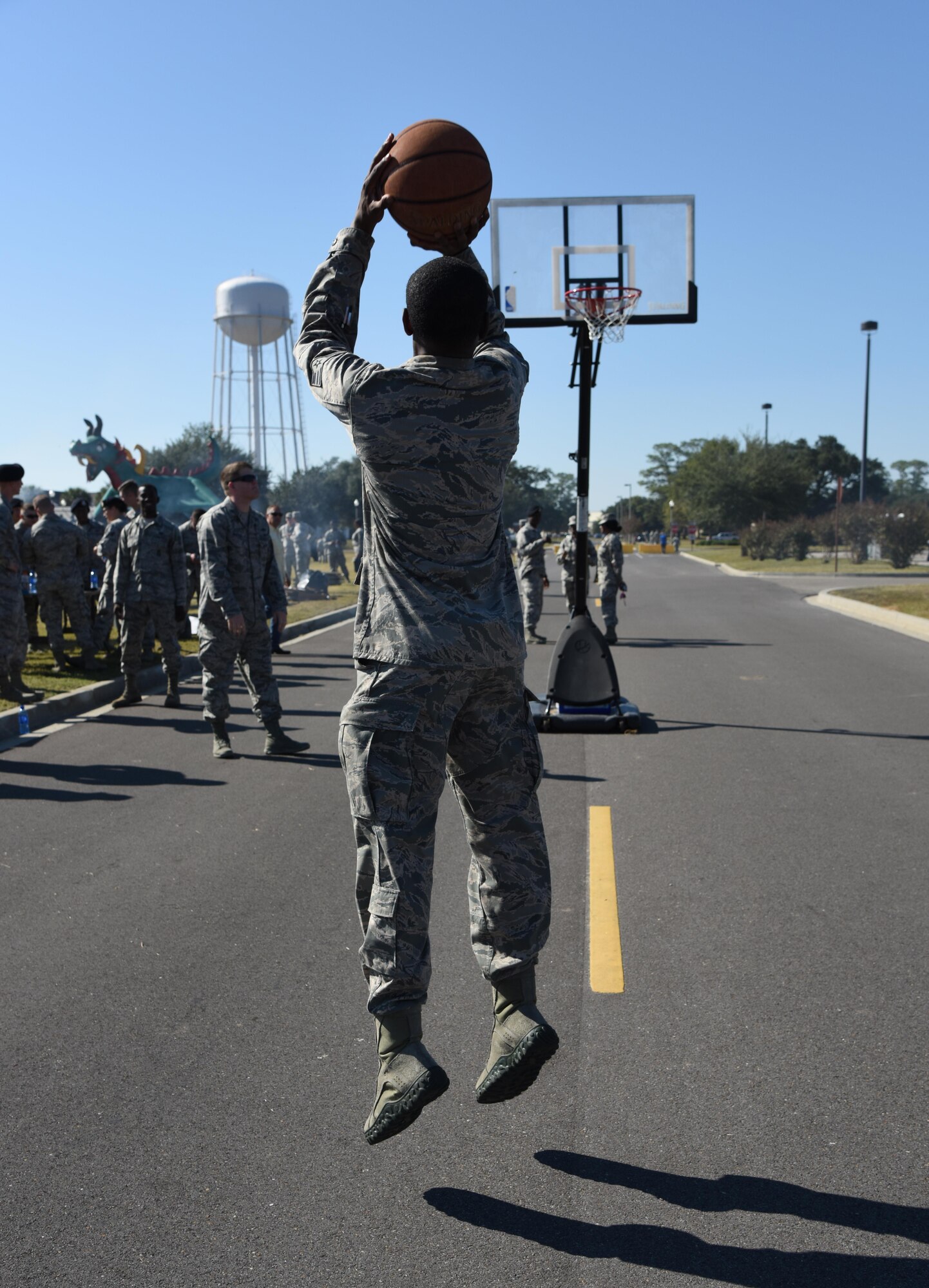 Senior Airman Brandon McCullum, 81st Diagnostic and Therapeutics Squadron pharmacy technician, shoots a basketball during Dragon Fest Nov. 17, 2016, on Keesler Air Force Base, Miss. Dragon Fest was the final event held for Dragon Week, which focused on resiliency and teambuilding initiatives across the base. (U.S. Air Force photo by Kemberly Groue)