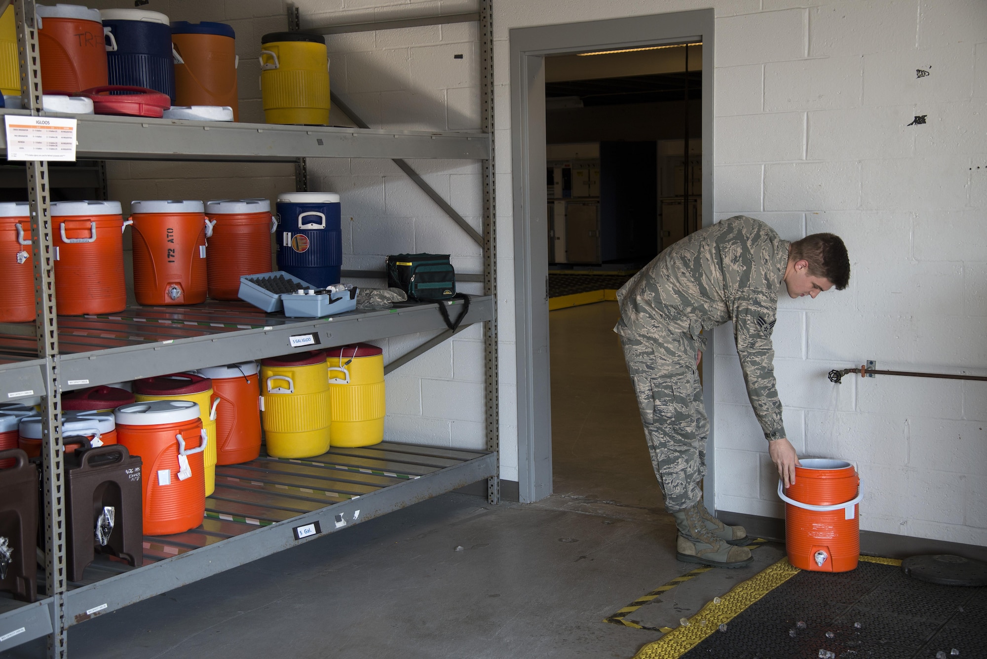 Senior Airman Alexander Delfs, 436th Aerospace Medical Squadron bioenvironmental engineering journeyman, runs water for testing Nov. 16, 2016, at an aircraft watering point on Dover Air Force Base, Del. Members of the 436th AMDS biomedical engineering flight are responsible for monitoring air quality, respiratory protection and water quality for the installation. (U.S. Air Force photo by Senior Airman Aaron J. Jenne)