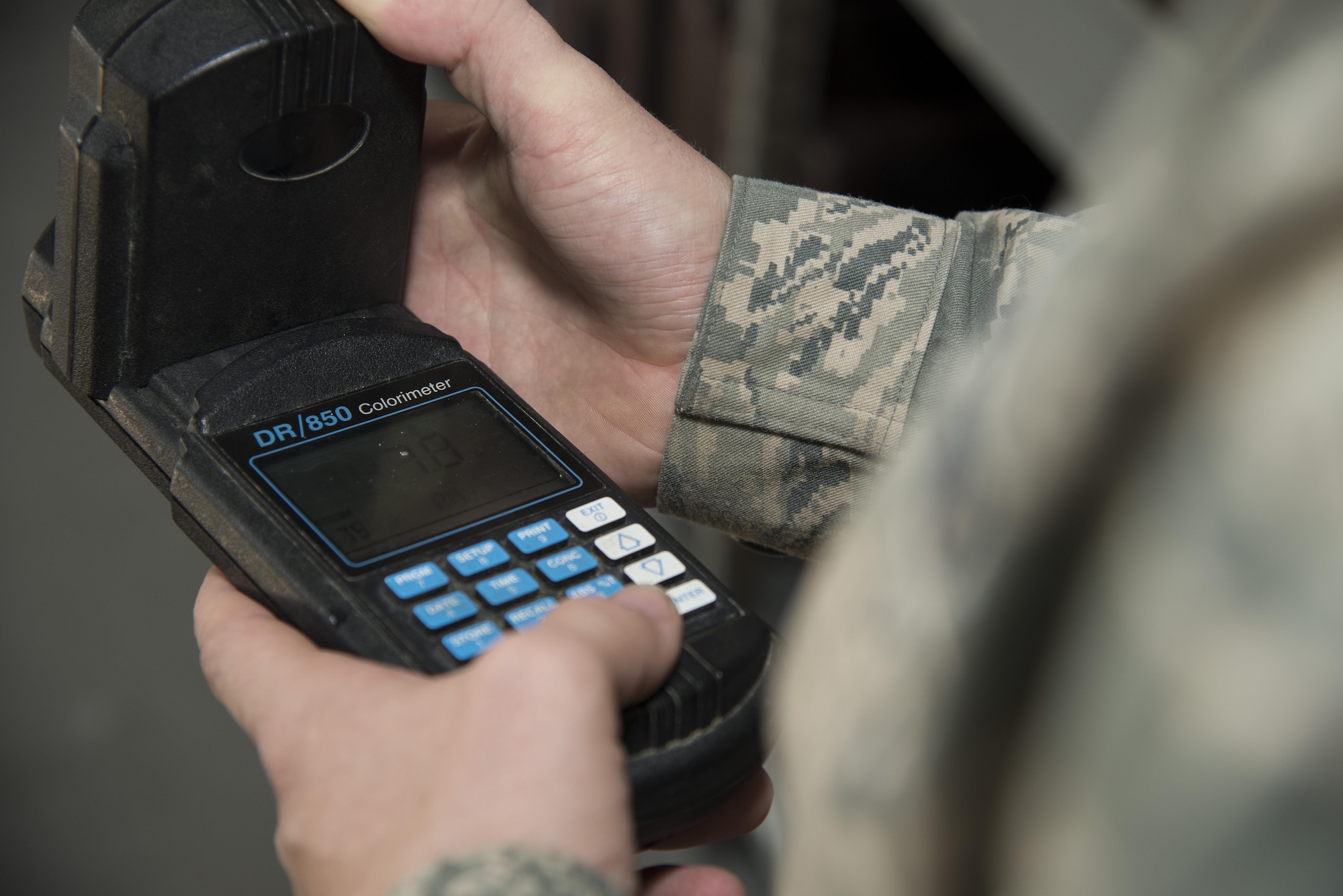 Senior Airman Alexander Delfs, 436th Aerospace Medical Squadron bioenvironmental engineering journeyman, examines water chemistry test results on a colorimeter Nov. 16, 2016, at an aircraft watering point on Dover Air Force Base, Del. Water testers are able to monitor multiple chemical concentrations with a colorimeter, including pH, chlorine and fluoride. (U.S. Air Force photo by Senior Airman Aaron J. Jenne)