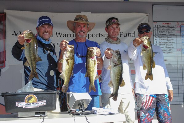 CLEWISTON, Fla. (Nov. 6, 2016) Participants weigh their catch at the Operation Bass Warrior fishing tournament. U.S. Central Command (CENTCOM) communications branch (J6) chief, Thomas Loftis (far right), a former Clewiston resident and retired Marine, organized the event with a network of friends and family as a way of giving back to those who served and sacrificed. (Courtesy photo)
