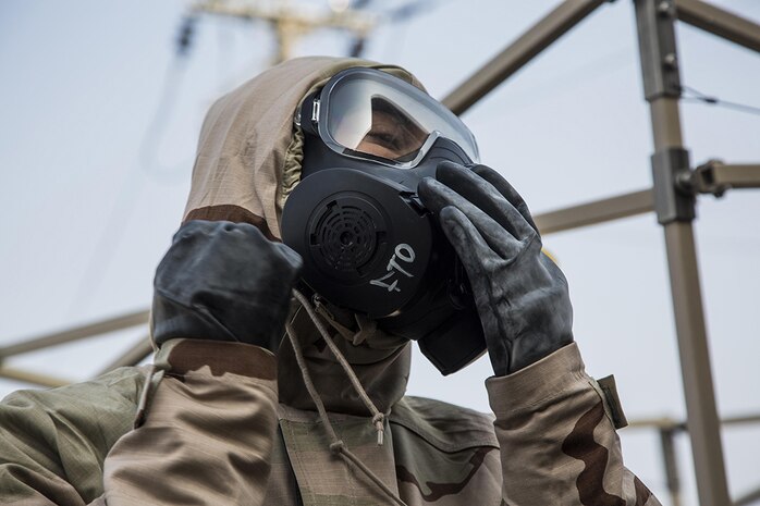 U.S. Marines and U.S. Airmen work together during a simulated contamination control area in preparation of Vigilant Ace 17-1 at Osan Air Base, Korea, Nov. 17, 2016. Vigilant Ace is a biannual, bilateral training event that exercises U.S. military and Republic of Korea Air Force interoperability through simulated wartime tasking.