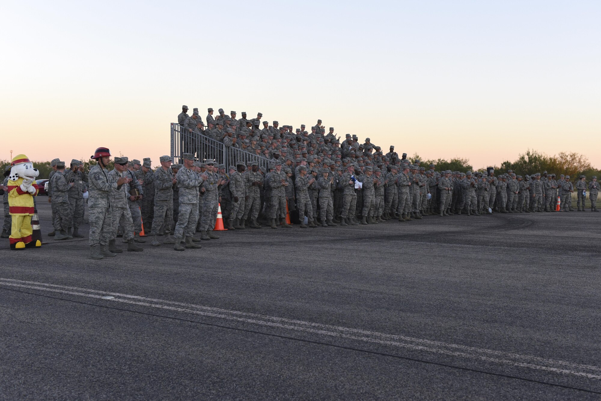Airmen from the 315th Training Squadron stand to witness the drill competition at the flight line on Goodfellow Air Force Base, Texas, Nov. 16, 2016. The 316th Training Squadron won the competition. (U.S. Air Force photo by Airman 1st Class Chase Sousa/Released)