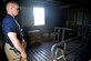 A 22nd Civil Engineer Squadron firefighter stands on the third floor of the base fire department’s structural trainer building Oct. 18, 2016, at McConnell Air Force Base, Kan. Currently, this floor is mainly used for search and rescue training, but will soon be converted into a Class B propane combustion room. (U.S. Air Force photo/Airman Erin McClellan)