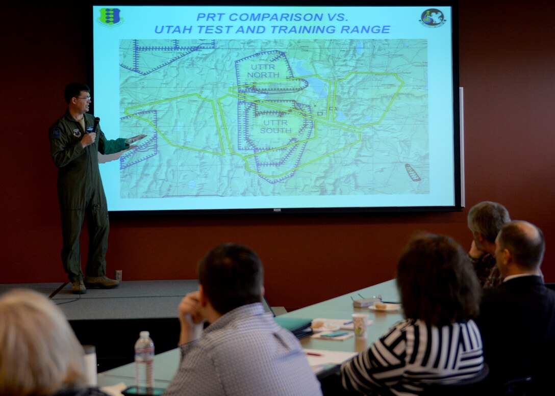 Lt. Col. James Ross, assistant director of operations assigned to the 28th Operations Support Squadron, presents information on the Powder River Training Complex during the inaugural Powder River Council meeting in the deployment center at Ellsworth Air Force Base, S.D., Nov. 16, 2016. During the meeting, PRC members discussed issues for mutual understanding including radar coverage, air traffic control assistance, large force exercises and near-miss incidents. (U.S. Air Force Photo by Senior Airman Rebecca Imwalle)