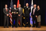 Capt. Michael Ladner, program manager Surface Ship Weapons holds his Program Manager of the Year award during the 2016 Department of the Navy Acquisition Excellence Awards ceremony at the Pentagon, Nov. 17.

Also pictured from left to right: Sean Stackley, Assistant Secretary of the Navy (Research, Development and Acquisition); William Bray, executive director, Program Executive Office Integrated Warfare Systems; Rear Adm. Doug Small, Program Executive Office Integrated Warfare Systems; Bill Deligne, executive director, Naval Sea Systems Command; Janine Anne Davidson, Under Secretary of the United States Navy.
