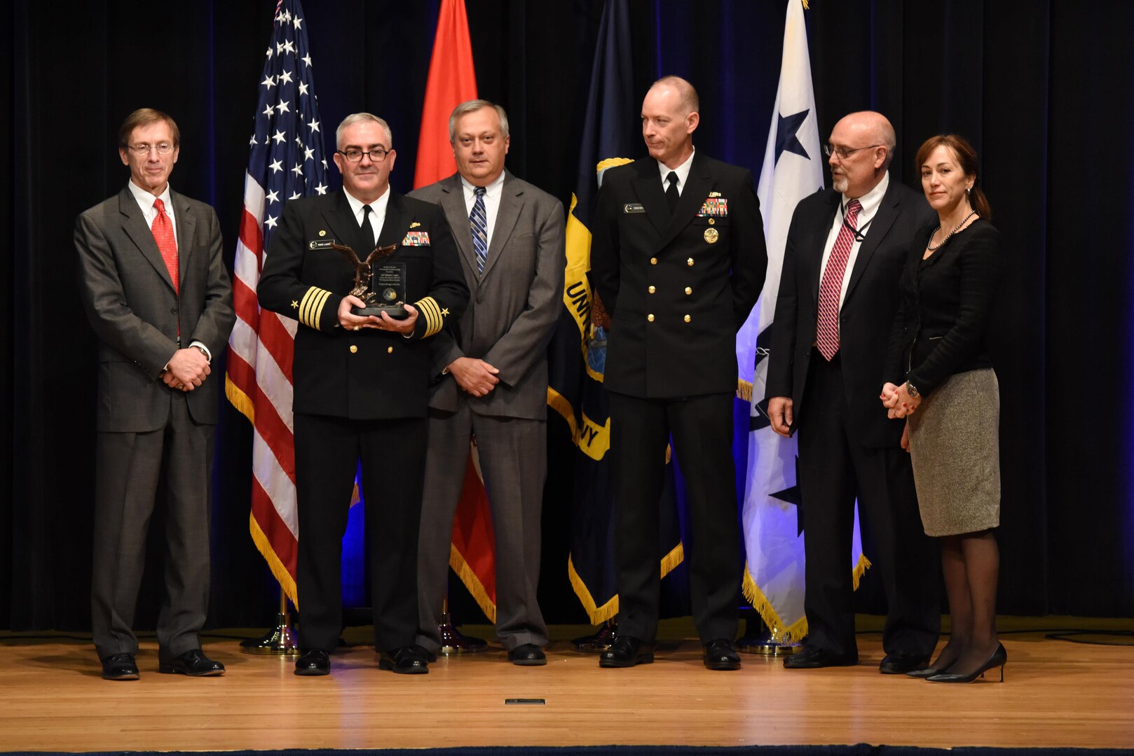Capt. Michael Ladner, program manager Surface Ship Weapons holds his Program Manager of the Year award during the 2016 Department of the Navy Acquisition Excellence Awards ceremony at the Pentagon, Nov. 17.

Also pictured from left to right: Sean Stackley, Assistant Secretary of the Navy (Research, Development and Acquisition); William Bray, executive director, Program Executive Office Integrated Warfare Systems; Rear Adm. Doug Small, Program Executive Office Integrated Warfare Systems; Bill Deligne, executive director, Naval Sea Systems Command; Janine Anne Davidson, Under Secretary of the United States Navy.
