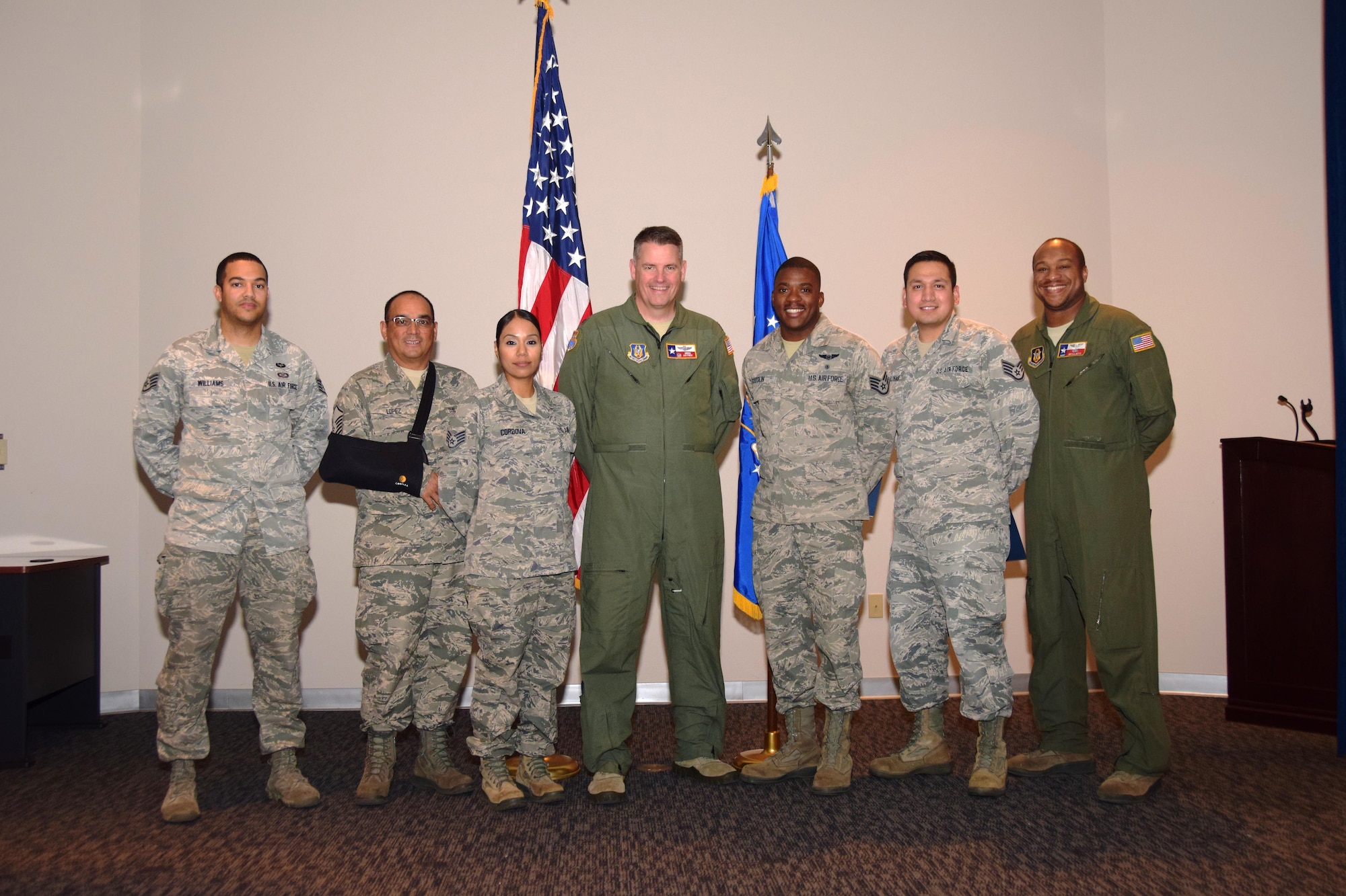 Col. Greg Haynes, center, 433rd Operations Group commander, congratulates Staff Sgt. Jerome Williams, Master Sgt. Jesse Lopez, Staff Sgt. Celina Cordova, Staff Sgt. Shillen Goodlin, Staff Sgt. Oracio Salinas and Master Sgt. Bryan Boyd, after they are presented their Community College of the Air Force degrees Nov. 5, 2016 in a ceremony held at the Inter American Air Forces Academy at Joint Base San Antonio, Lackland, Texas. (U.S. Air Force photo by Tech. Sgt. Carlos J. Treviño) 
