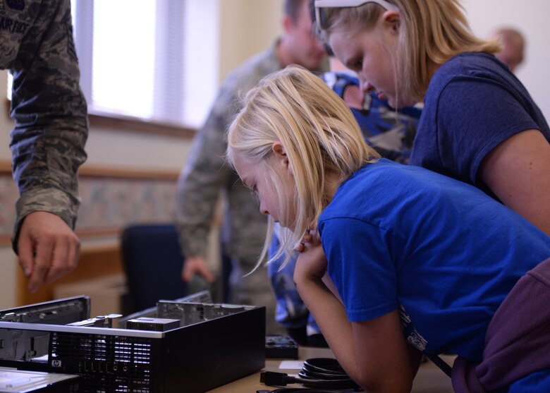 Students from local elementary schools examine different parts of a computer tower during the science, technology, engineering and math fair, Nov. 17, 2016, at Altus Air Force Base, Okla. The STEM fair brought together 5th grade students and teachers, showcasing STEM to local students and how those subjects can relate to different Air Force careers. (U.S. Air Force photo by Airman 1st Class Cody Dowell/Released)