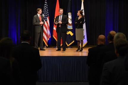 Assistant Secretary of the Navy (Research, Development and Acquisition) Sean Stackley (left) presented Naval Sea Systems Command’s Mike Gutermuth the Rear Admiral Wayne E. Meyer Memorial Award as Janine Anne Davidson, Under Secretary of the United States Navy looks on during the 2016 Department of the Navy Acquisition Excellence Awards at the Pentagon, Nov. 17. 
