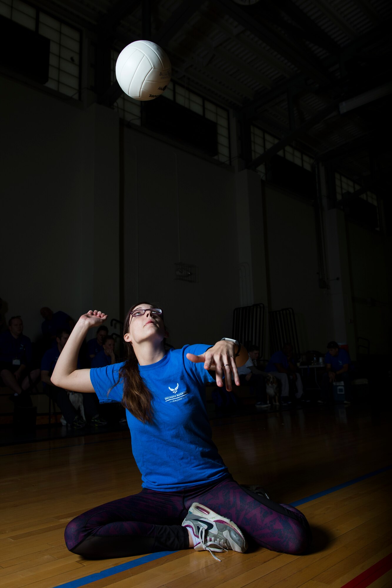 Senior Airman KieLani Vessar, 55th Medical Operations Squadron medical technician, prepares to hit a volleyball while playing sitting volleyball during the Northeast Region Warrior CARE Event at Joint Base Andrews, Md., Nov. 17, 2016. Vessar has disc disease that causes severe back pain that makes daily life difficult. The events are a part of a week-long program that features education in Caregiver Support, Adaptive and Rehabilitative Sports, Recovering Airman Mentorship, and Employment and Career Readiness. (U.S. Air Force photo by Senior Airman Philip Bryant)