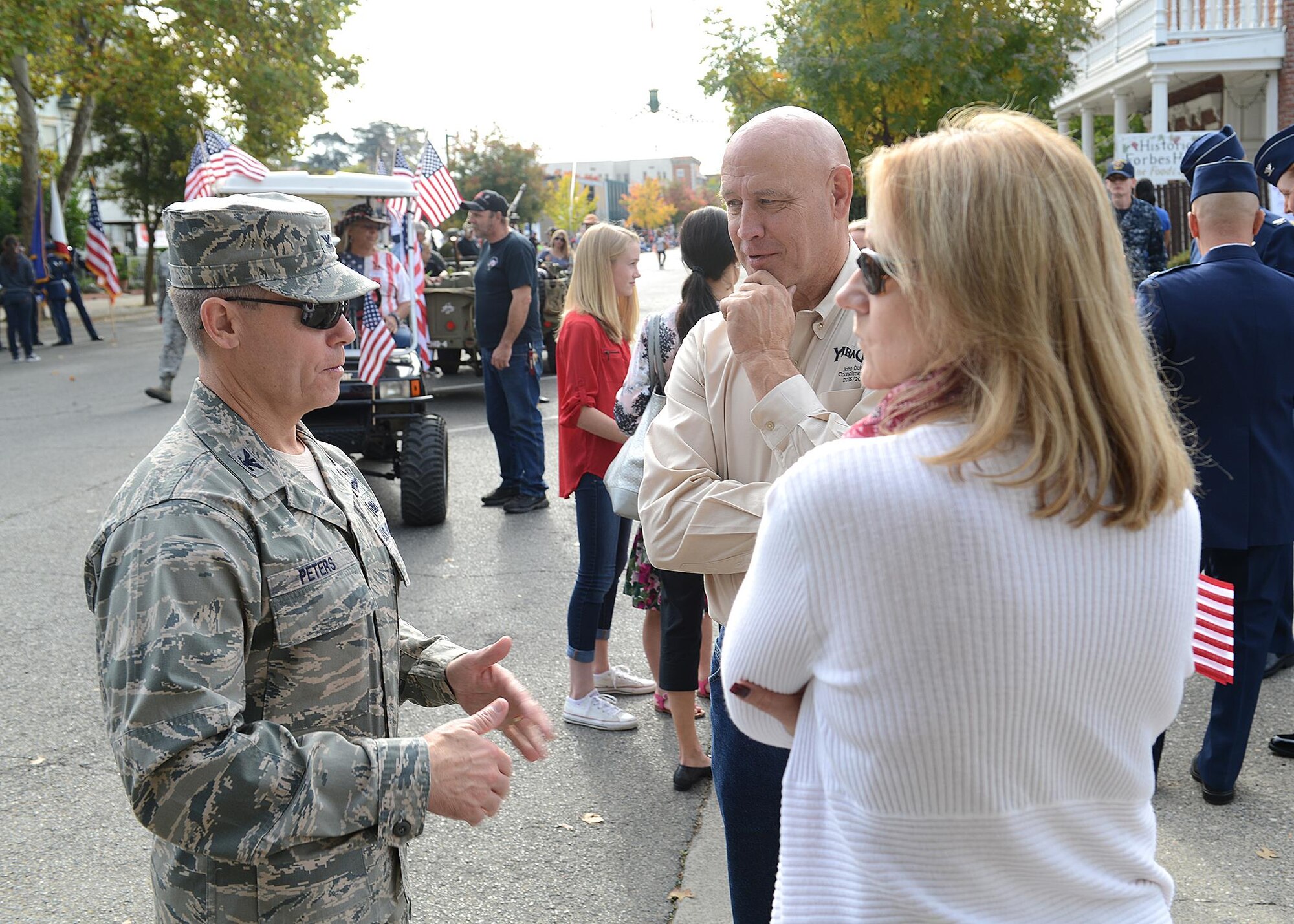 940th Air Refueling Wing commander, Col. Craig C. Peters and his wife, Cathie, converse with John Dukes, mayor of Yuba City, California at the 14th Annual Yuba-Sutter Veterans Day parade on Nov. 11, 2016 in Marysville, California. The parade honored those who serve in the U.S. Armed Forces past, present and future. (U.S. Air Force photo by Sean Bhakta)