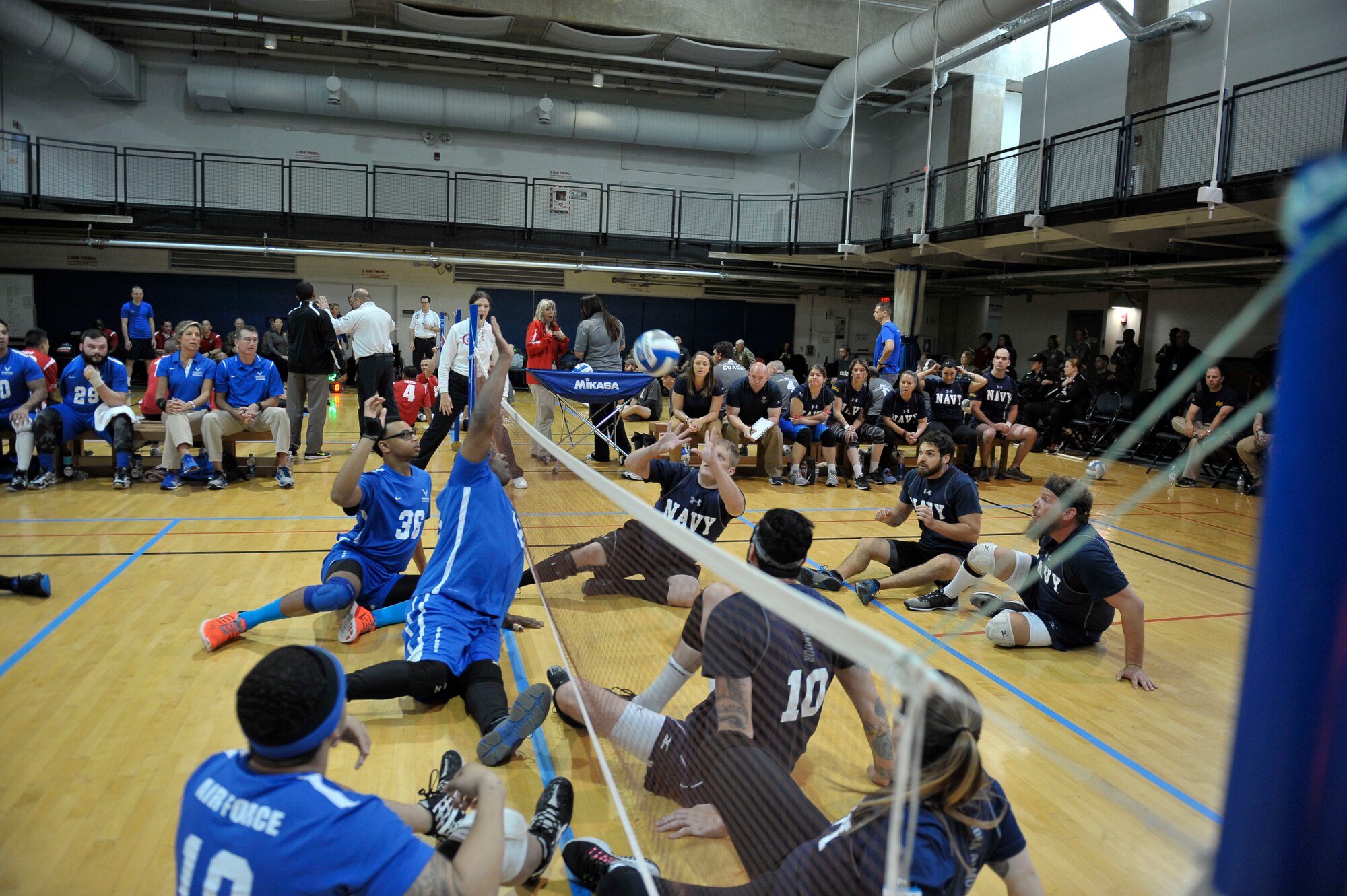 Sean Hook, an Army wounded warrior team member, serves the ball against the U.S. Special Operations Command wounded warrior team during the joint-service Warrior CARE Month Sitting Volleyball Tournament at the Pentagon Nov. 17, 2016. The Army team took home the trophy after defeating the SOCOM 25-23 in the final round. (U.S. Air Force photo/Tech. Sgt. Robert Barnett)