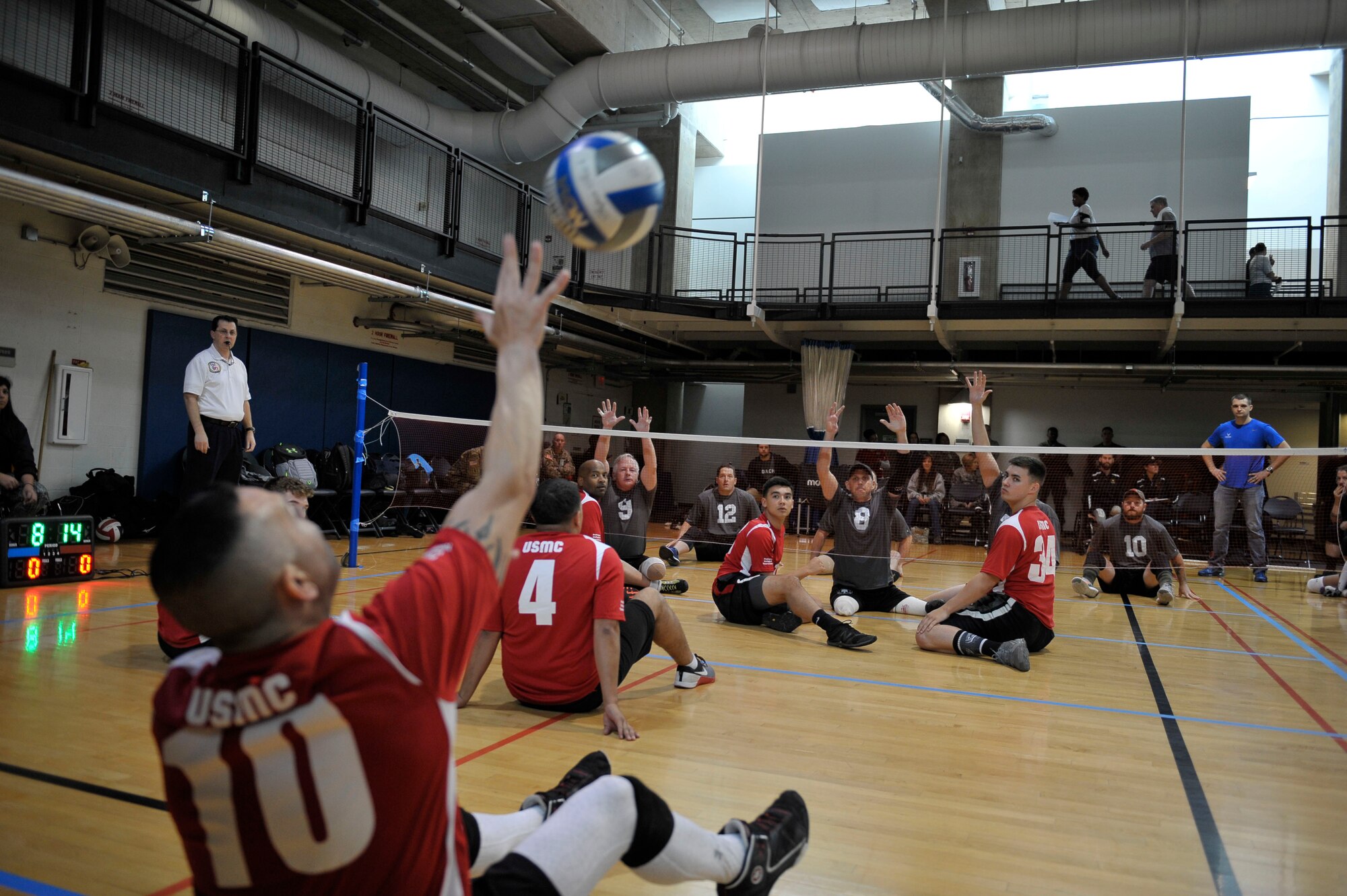 The Marine and U.S. Special Operations Command wounded warrior teams face off during the joint-service Warrior CARE Month Sitting Volleyball Tournament at the Pentagon Nov. 17, 2016. November is Warrior CARE Month.  CARE stands for Caregiver Support Program, Adaptive and Rehabilitative Sports Program, Recovering Airmen Mentorship Program, and Employment and Career Readiness Program. (U.S. Air Force photo/Tech. Sgt. Robert Barnett)