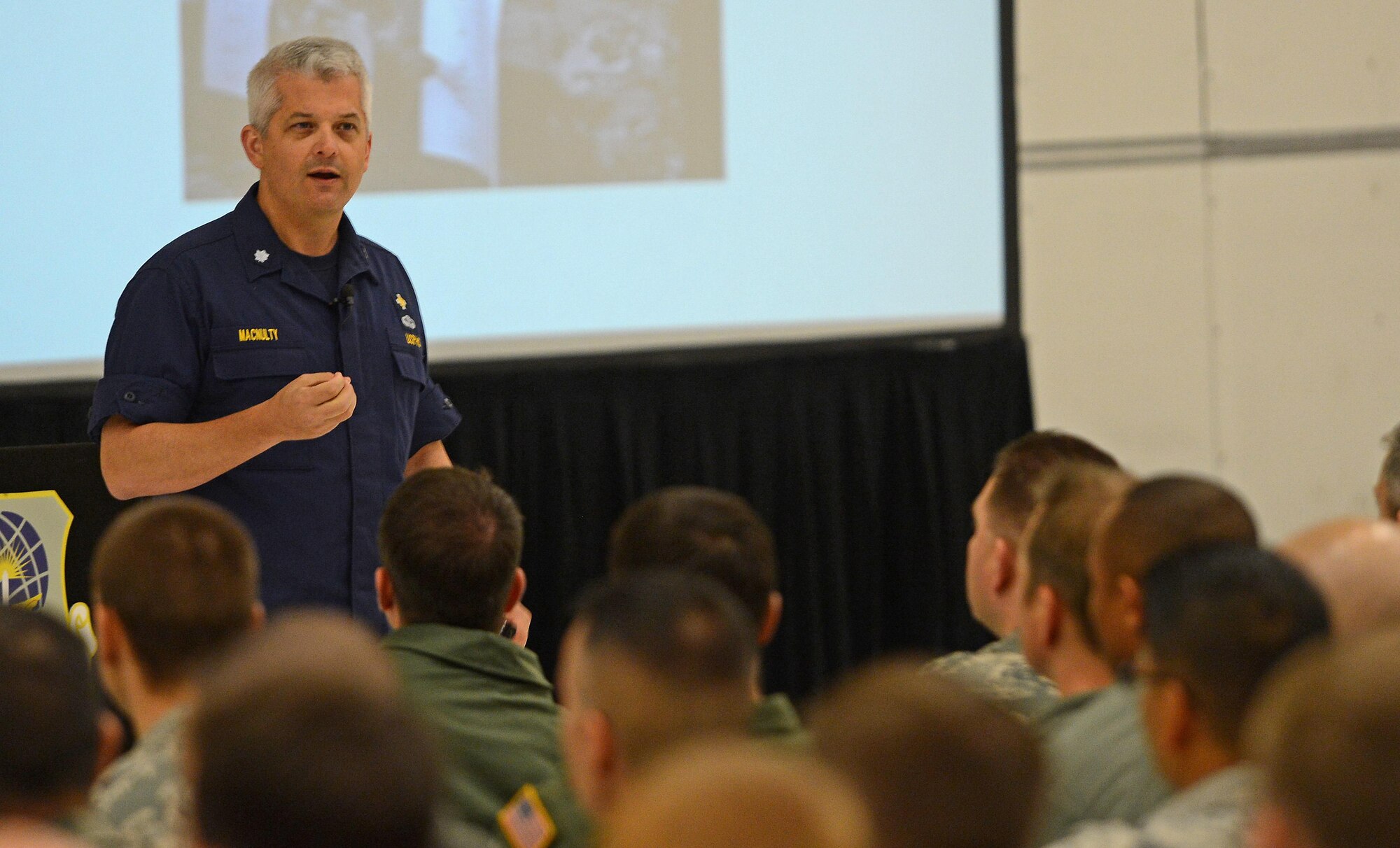 Dr. Bill MacNulty, U.S. Public Health Services health promotion psychologist, speaks with Team McChord Airmen during the biannual Wingman Day Nov. 18, 2016 at Joint Base Lewis-McChord, Wash. MacNulty is a certified psychologist and an officer of the U.S. Public Health Services. MacNulty spoke to Team McChord about “mindfulness base stress reduction” and coping with stress of balancing the mission and normal day-to-day life. (U.S. Air Force photo/Senior Airman Divine Cox)