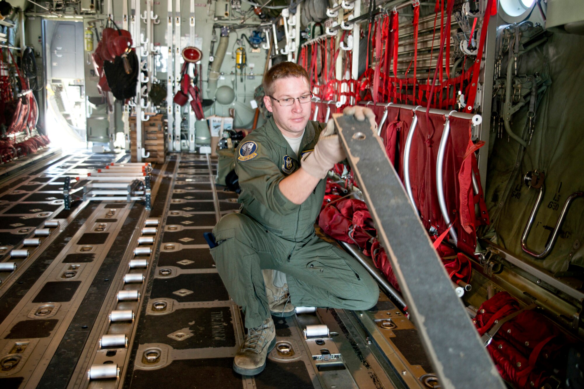 U.S. Air Force Reserve Master Sgt. Scott Klobucher, loadmaster, 327th Airlift Squadron, reconfigures a C-130J in preparation for loading a P-19 Fire Fighting Truck during the “Turkey Shoot” competition, Nov. 17, 2016, at Little Rock Air Force Base, Ark. The competition evaluated the technical skills of the crews and how they may perform in real world situations. (U.S. Air Force photo by Master Sgt. Jeff Walston/Released) 