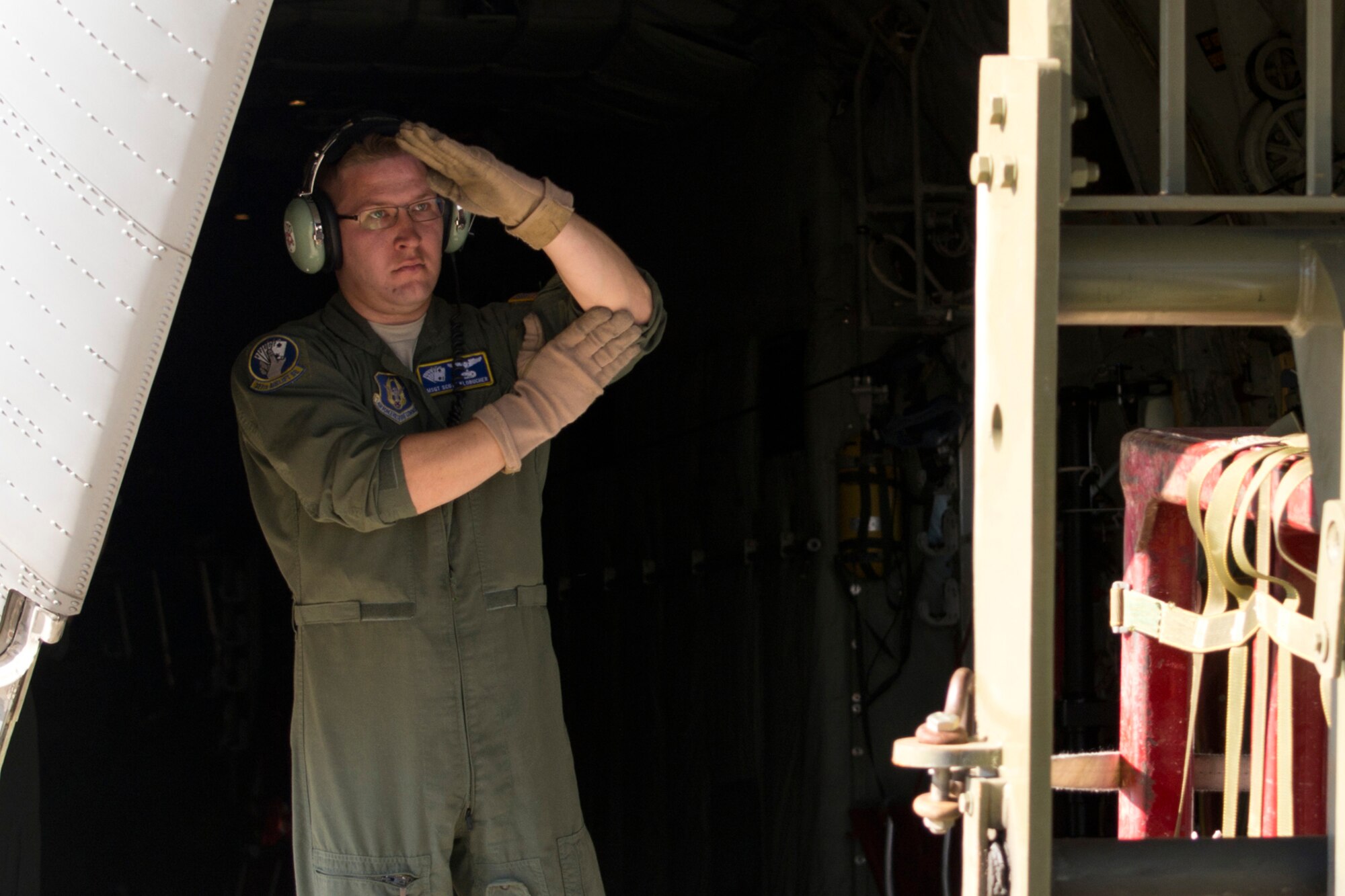 U.S. Air Force Reserve Master Sgt. Scott Klobucher, loadmaster, 327th Airlift Squadron, directs the driver of a 10K all-terrain forklift during the “Turkey Shoot” competition, Nov. 17, 2016, at Little Rock Air Force Base, Ark. Part of the competition involved various loading and off-loading scenarios while the engines of the C-130J are running. (U.S. Air Force photo by Master Sgt. Jeff Walston/Released) 